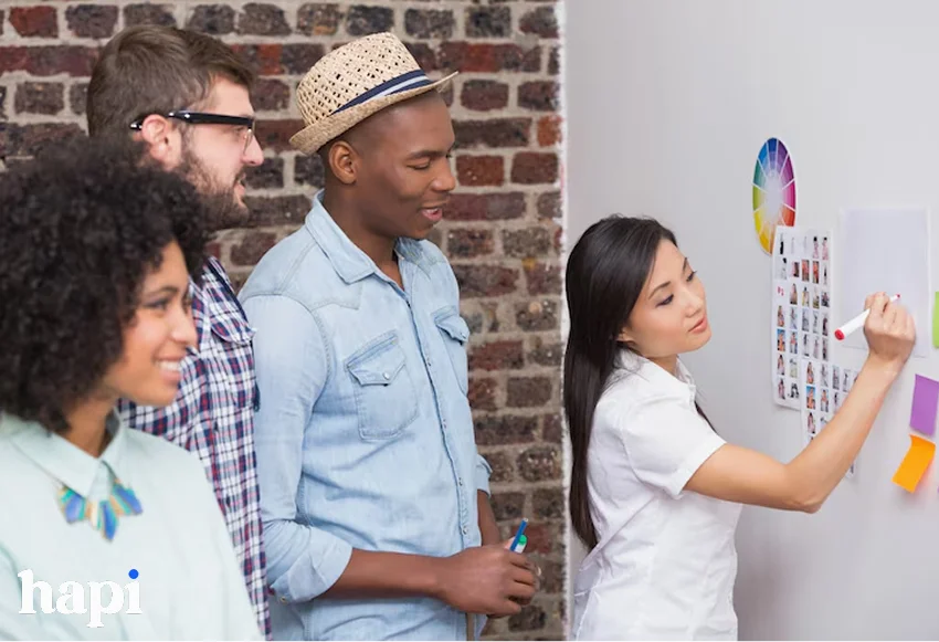 a group of people working on a virtual art project