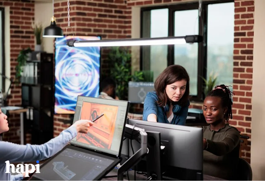 some girls working on a virtual art project