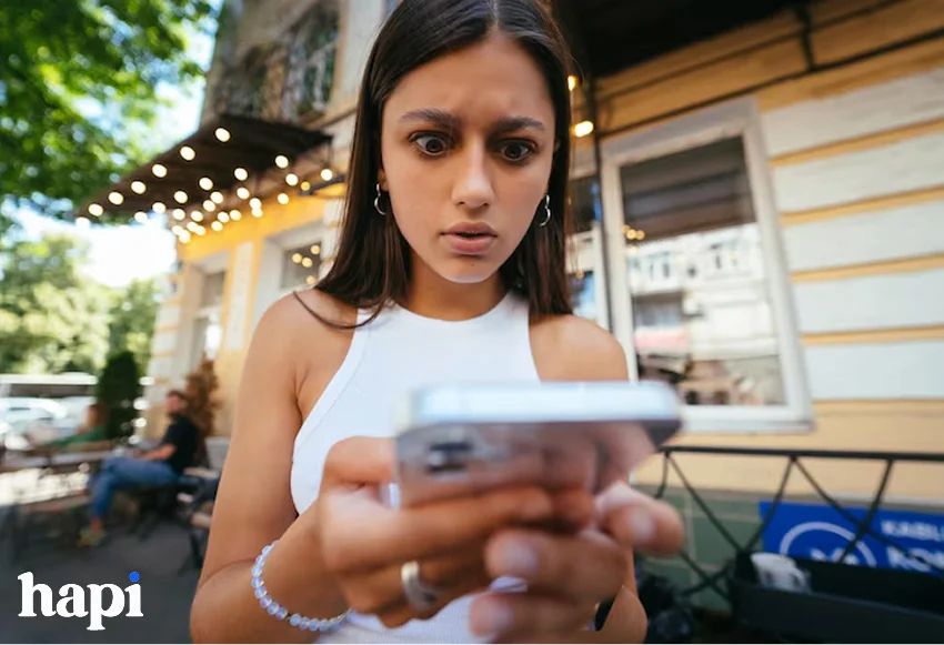 a suprised girl checking her phone