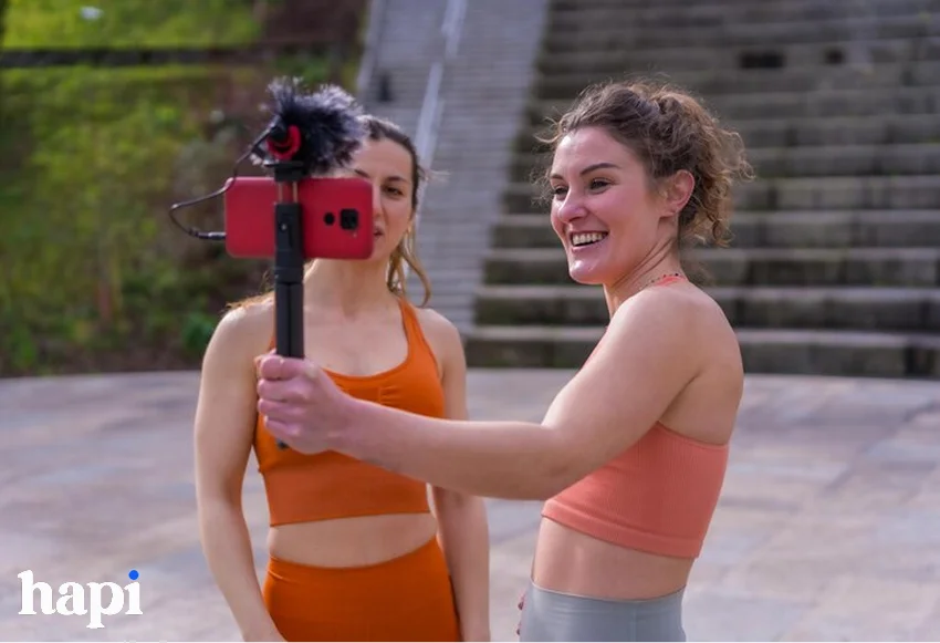 two influencers creating content while exercising