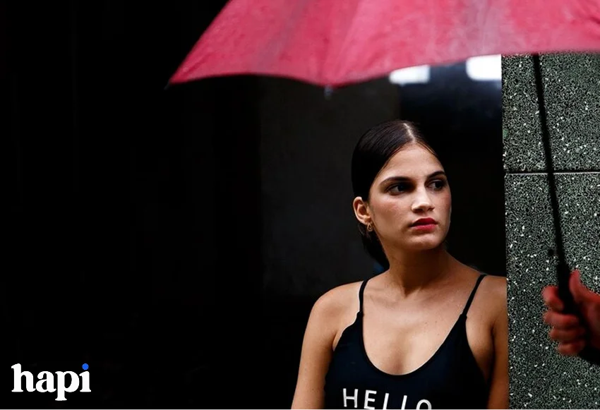 an influencer creating content in the rain