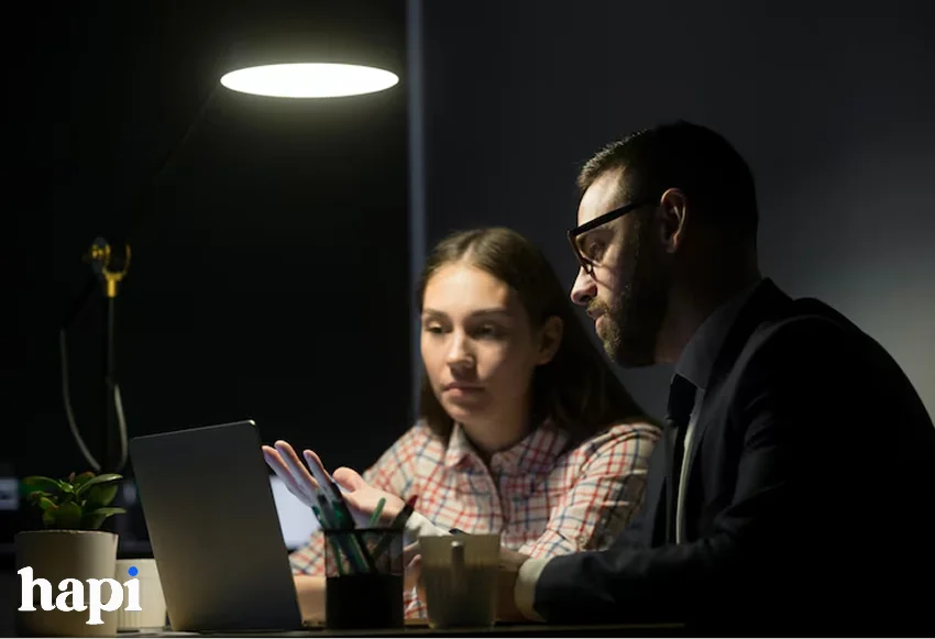 a boy and girl checking social media