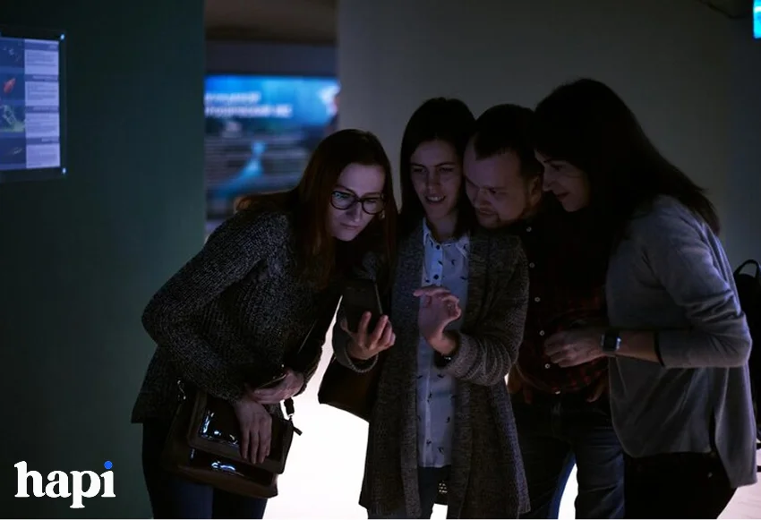 a groyp of friends checking social media