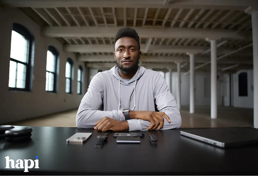 Marques Brownlee sitting behind a table