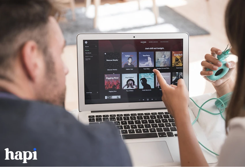 a man and woman using Spotify app