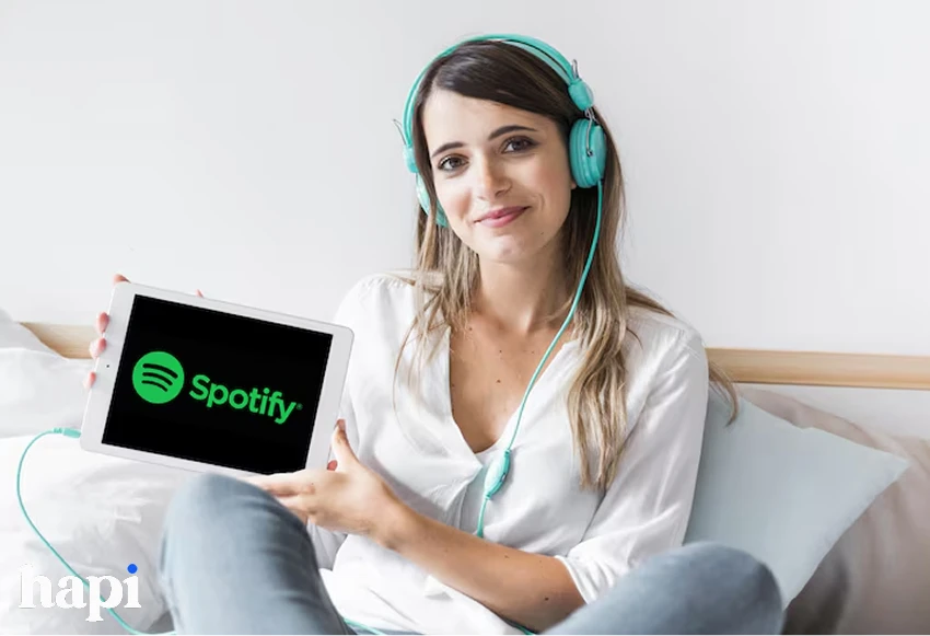 a woman showing Spotify app