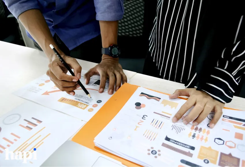 Two people analyzing data