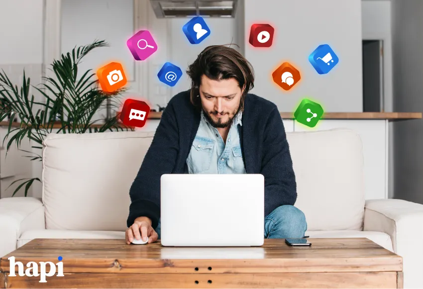 a man working on laptop sitting on a couch