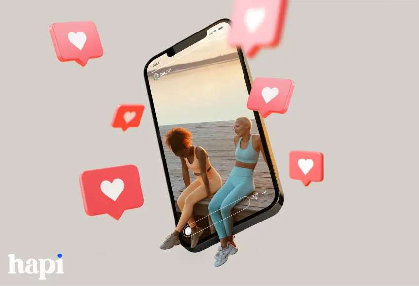 a phone showcasing two influencers on Instagram (they are made to appear 3D, their legs are out of the phone screen) with heart symbols surrounding the phone